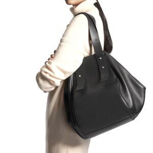 Stylish Black Leather Bowling Bag by COS - Versatile & Durable: nearly new